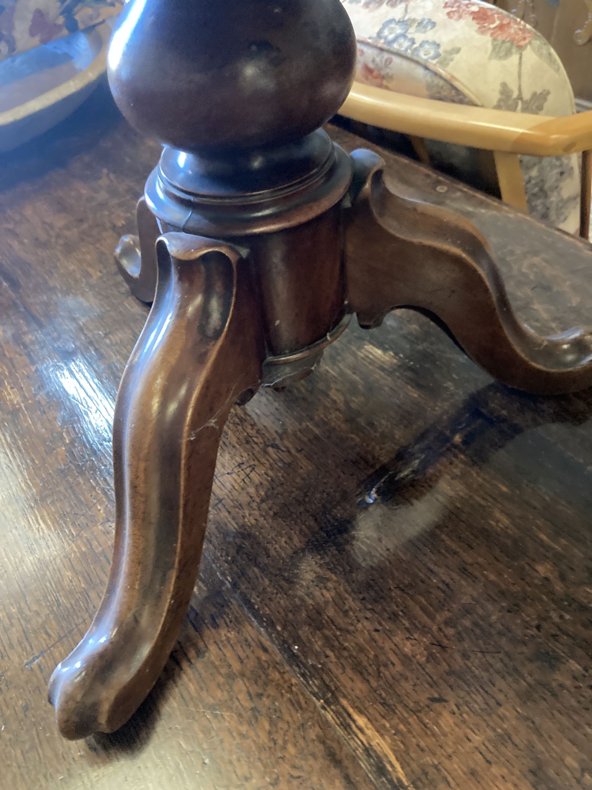 A Victorian revolving mahogany adjustable piano stool